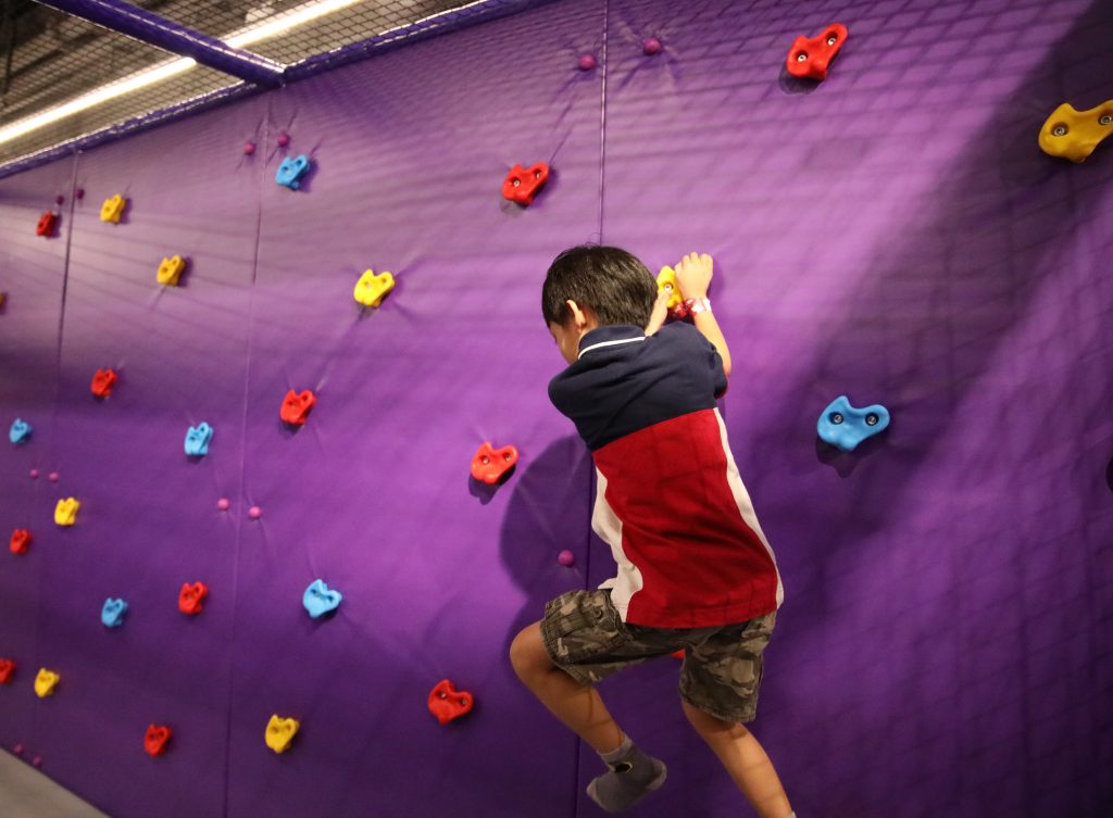 Let your kids showcase their inner Ninja Warrior at Kiztopia as they try various challenges such as rock climbing.