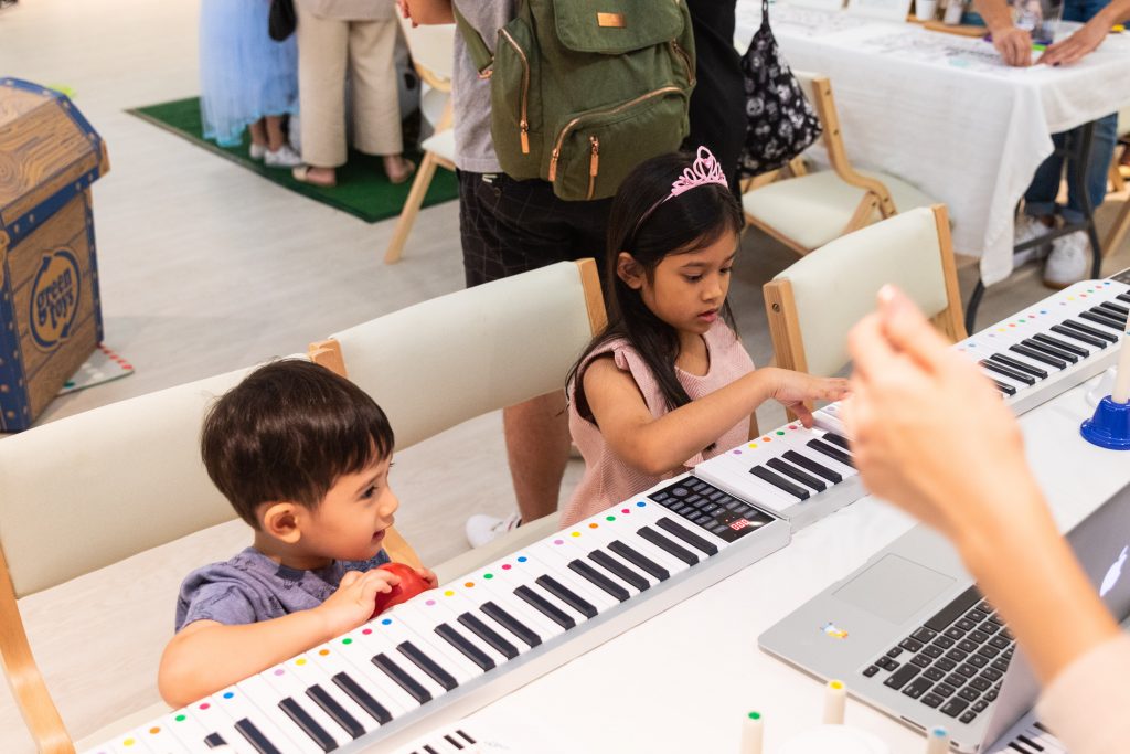 Children got to try playing the piano with JoyWaltzStudio.