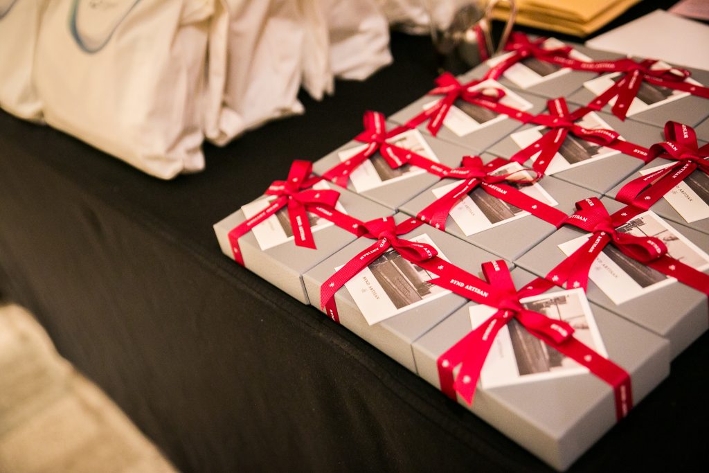 Some of the gifts for the guests included cardholders or notebooks from Bynd Artisan.