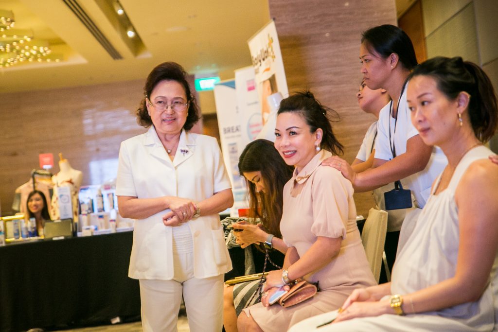 Our chief executive mummy, Dolores Au, enjoying a massage from Bodyworks Medicare.