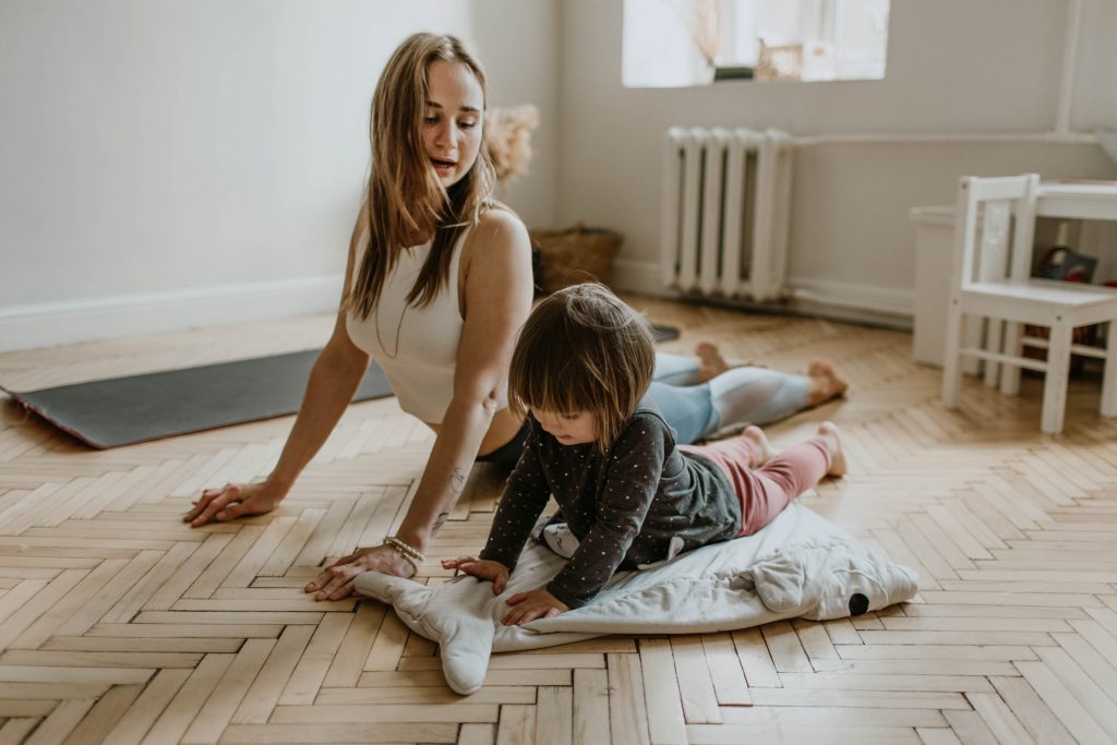 Exercise with your little one at home, whether it's dancing or a yoga workout.