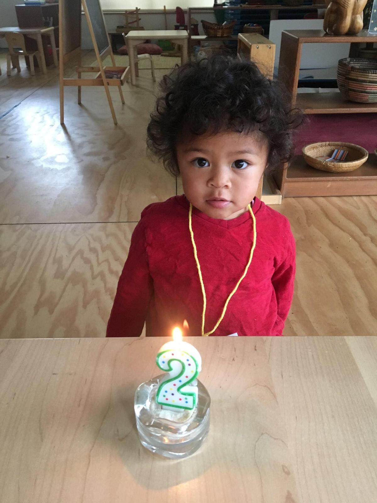 Katherine celebrating her second birthday at her prechool. The class bakes healthy cupcakes as a birthday treat for everyone together.