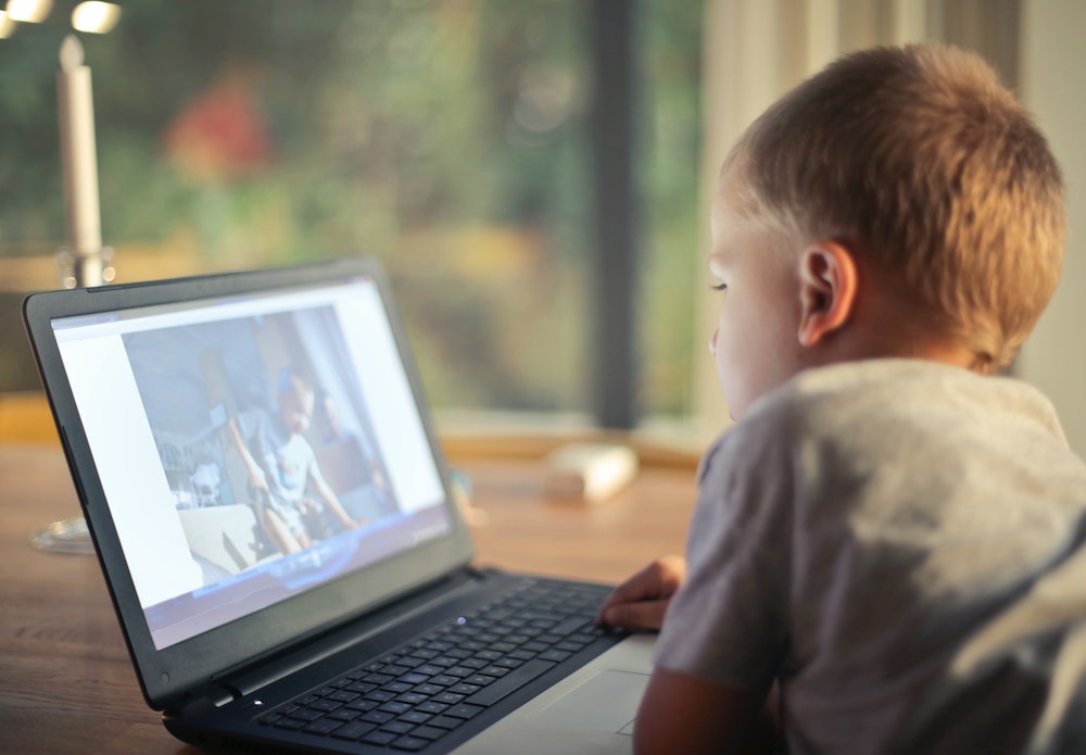 Supervise your child’s screen time to ensure they’re viewing only age-appropriate content. Image credit: Andrea Piacquadio