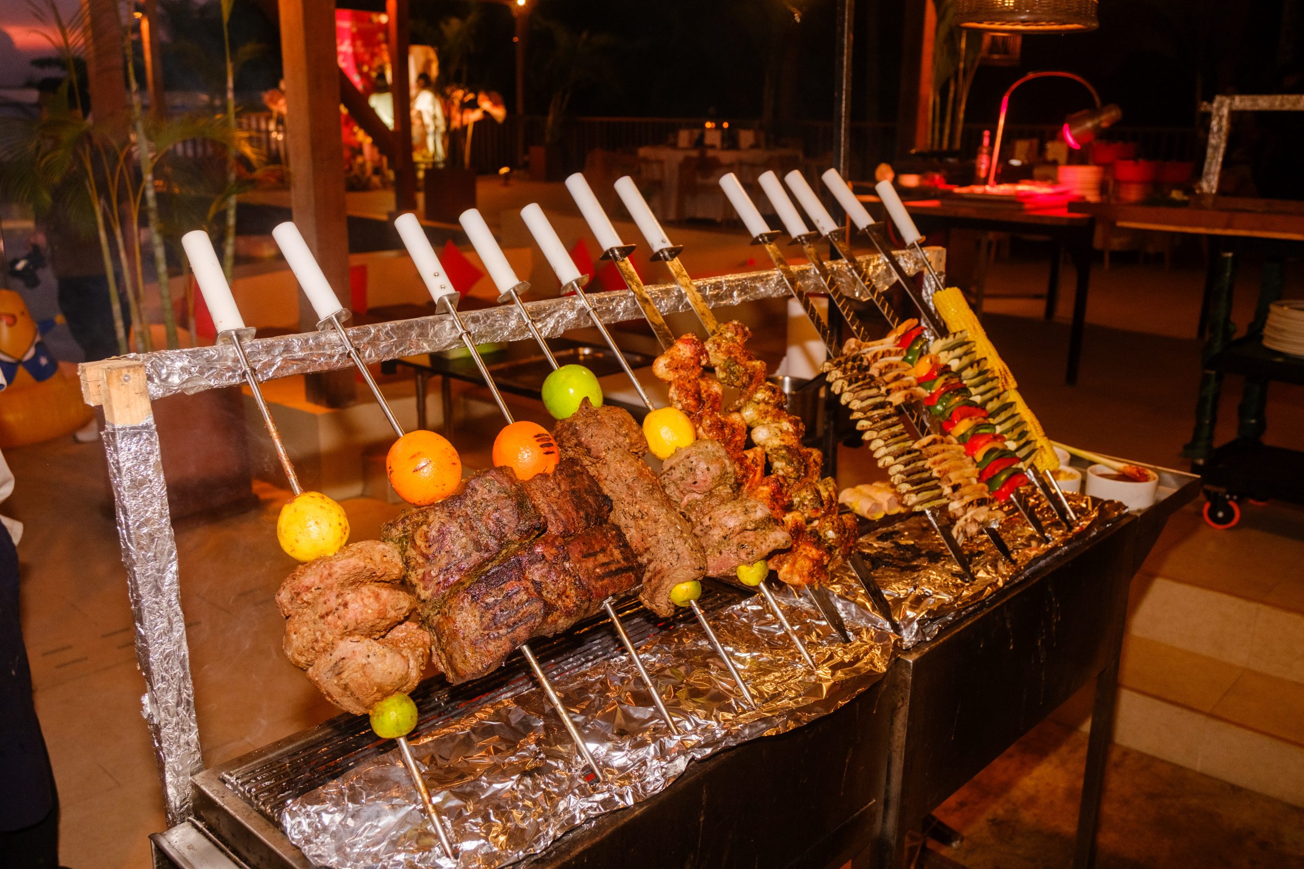 Brazilian-style carving of lamb leg, striploin, sausage and chicken wings